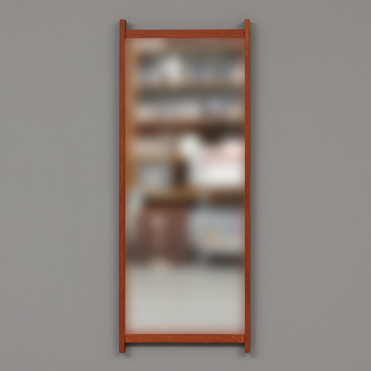 A mid 20th century teak mirror.