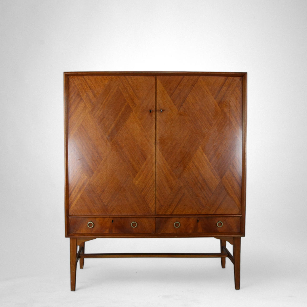 A teak cupboard, mid 20th century.
