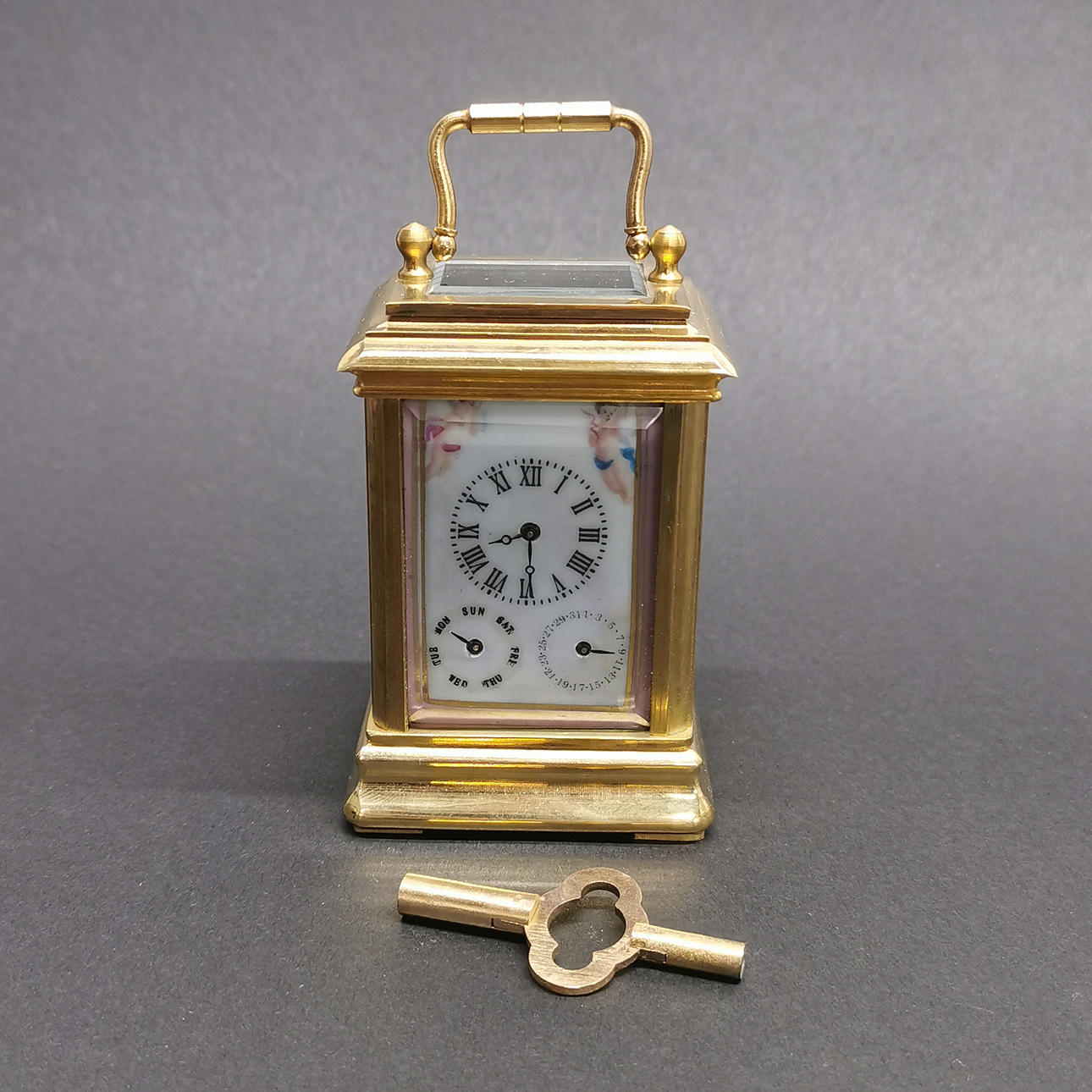 BRASS AND PORCELAIN CARRIAGE CLOCK.