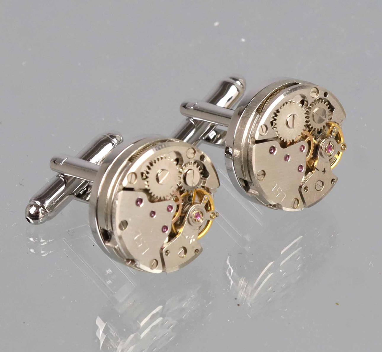 MANSCHETTENKNÖPFE, Uhrwerk Form.