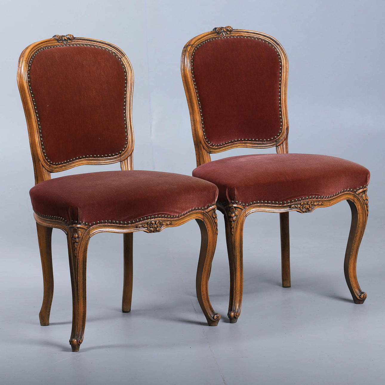 A pair of lounge chairs, rococo style.