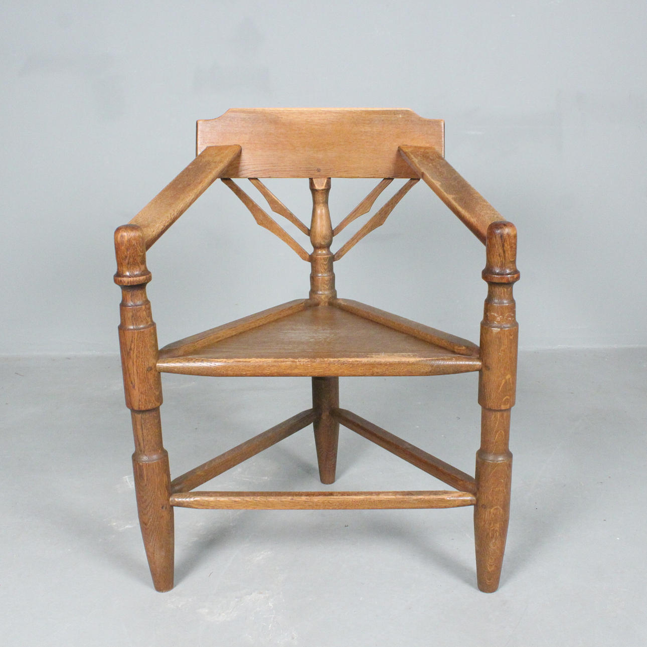 antique three-legged chair.