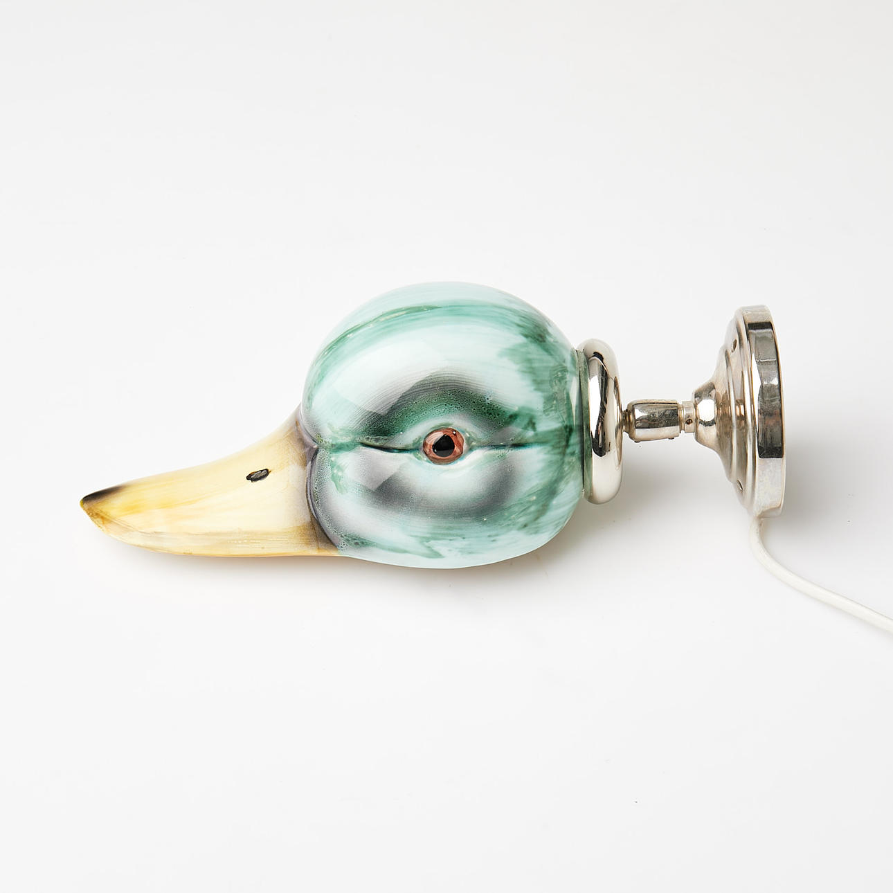 VÆGLAMPE. I form af et andehoved, Lampverkstad i Gamle By.