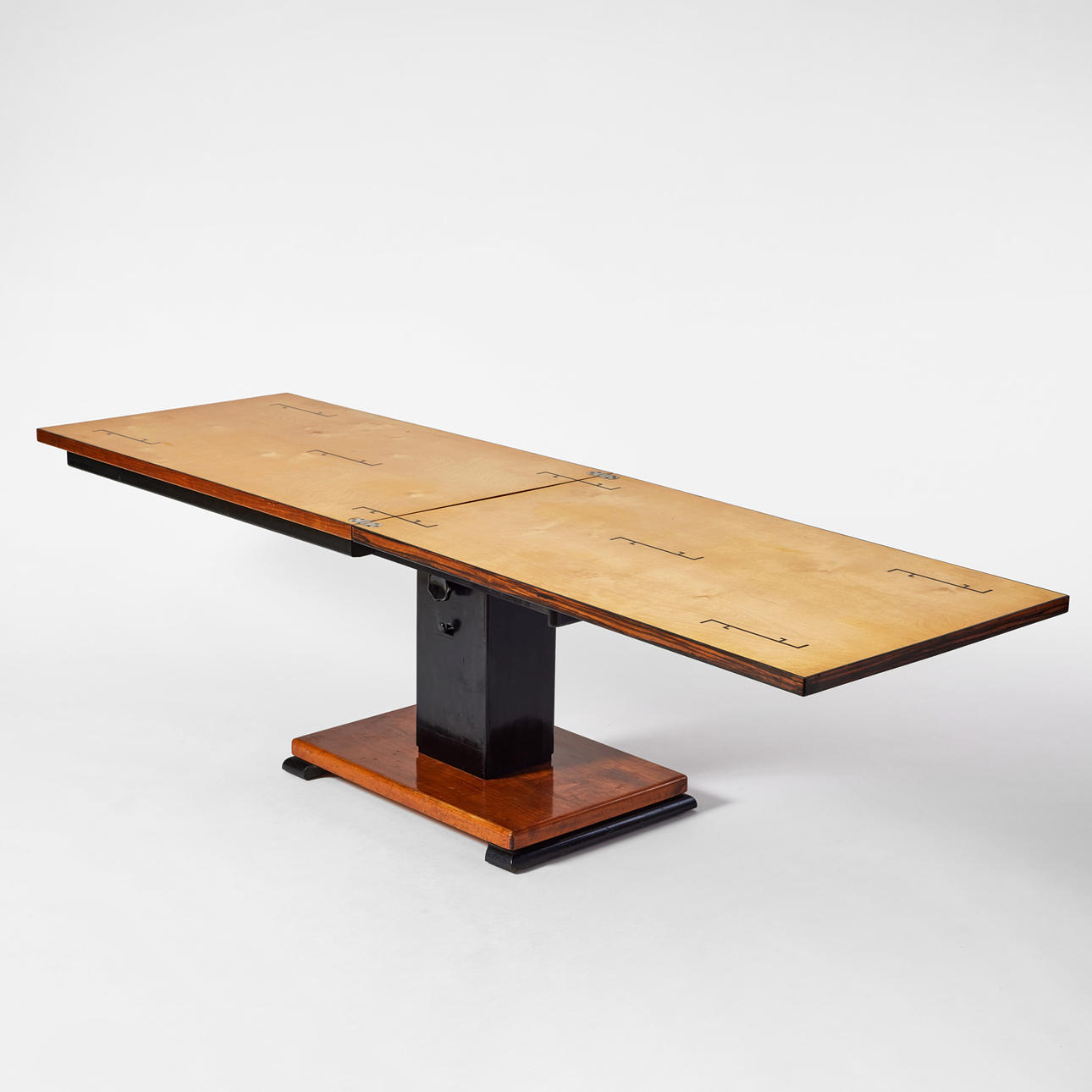 OTTO WRETLING. “Idealbord”, Umeå, 1930s, veneered with birch, teak and blackened wood, rectangular shape with folding top in light birch with stylized inlays, height-adjustable.