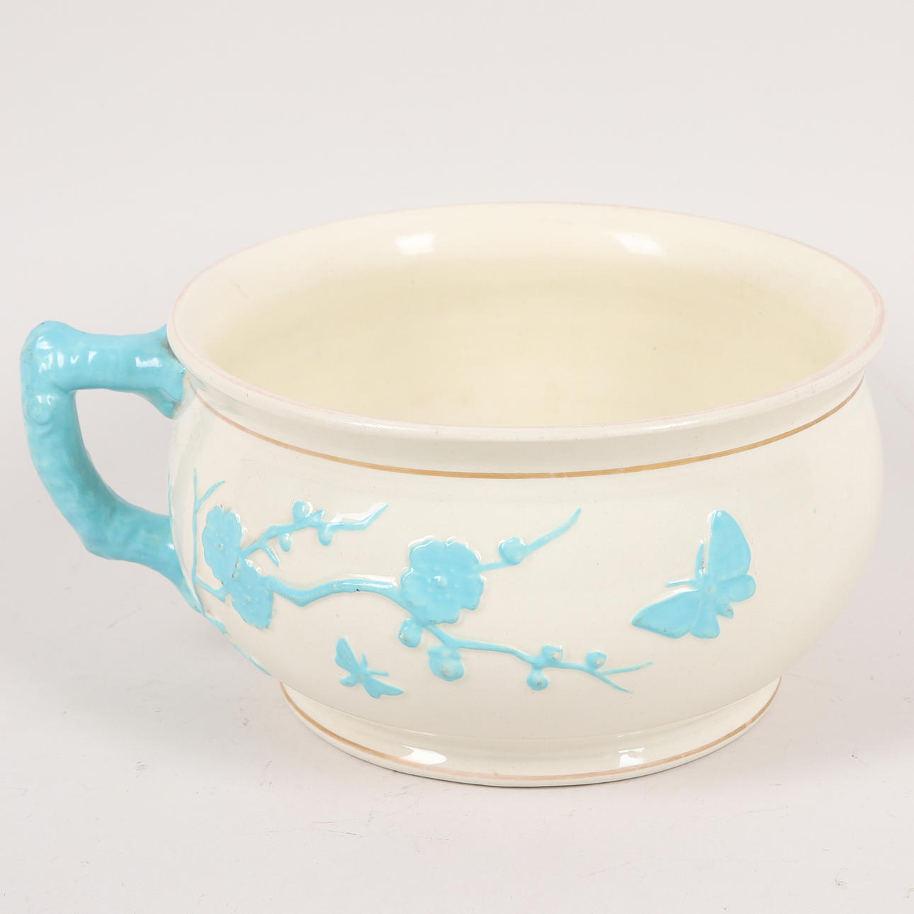 A ceramic bedpot, England, 20th century.