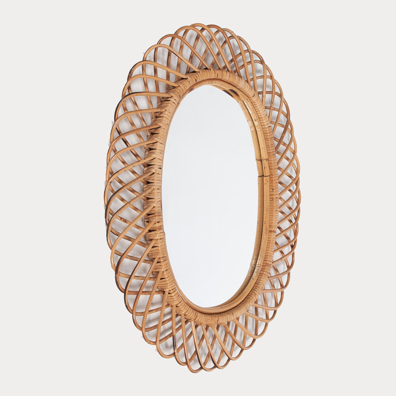 A rattan wall mirror, 20th century.