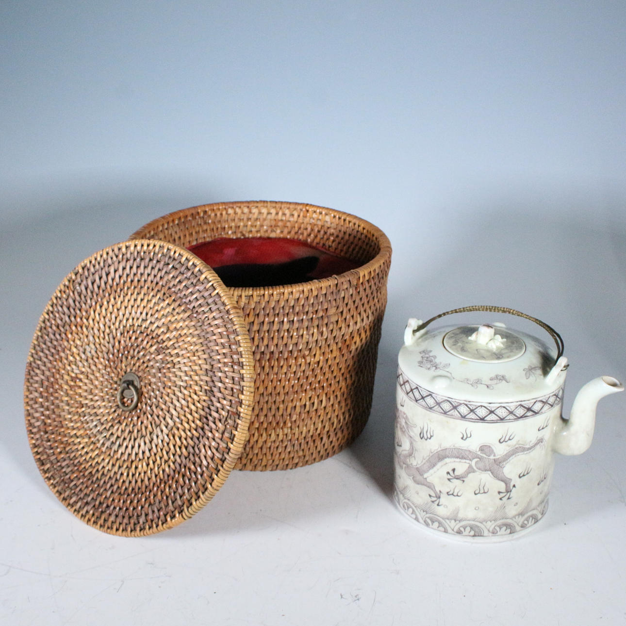 Chinese teapot in basket.