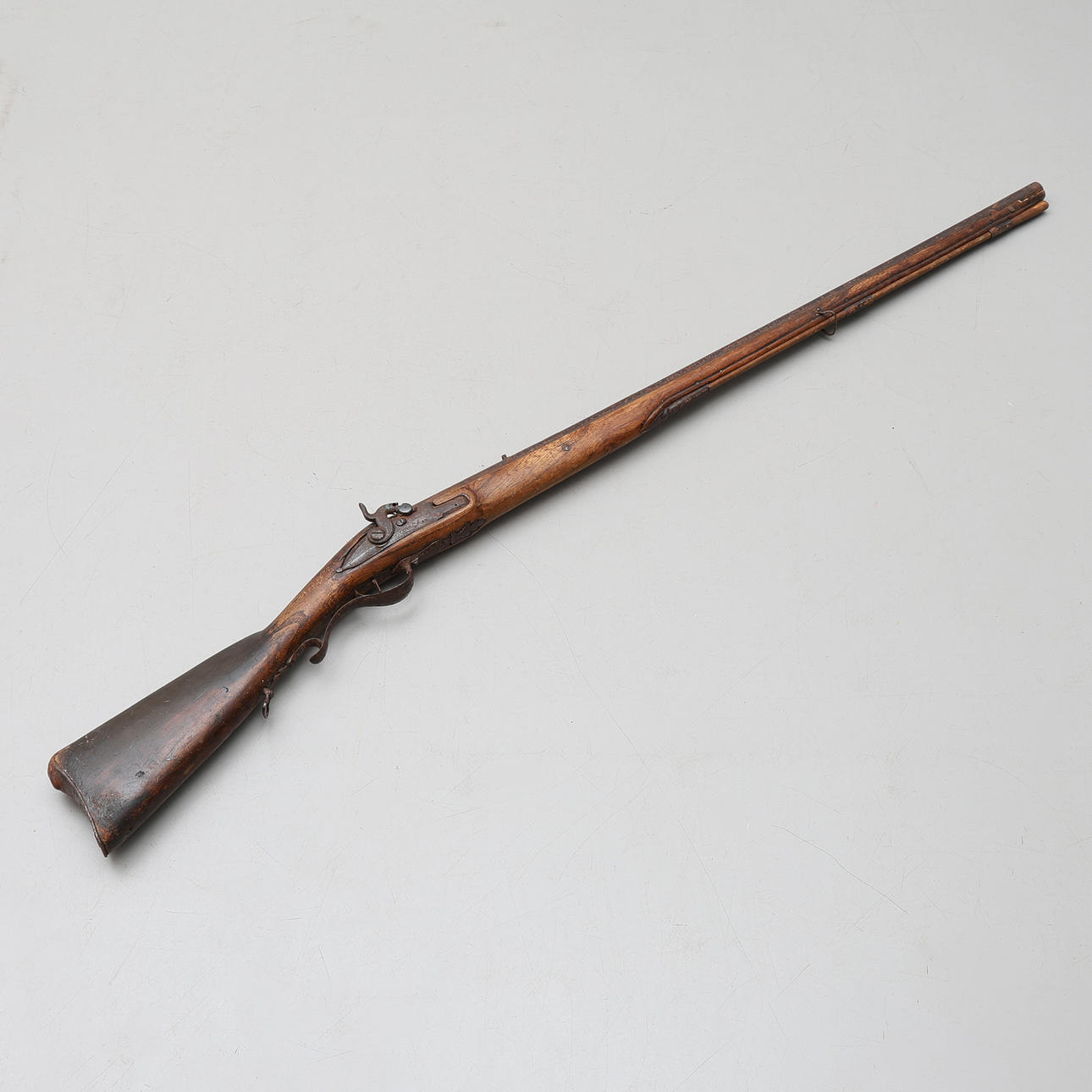 A CONVERTED SLAG LOCK RIFLE, 17th/19th century, the lock marked Melding ...