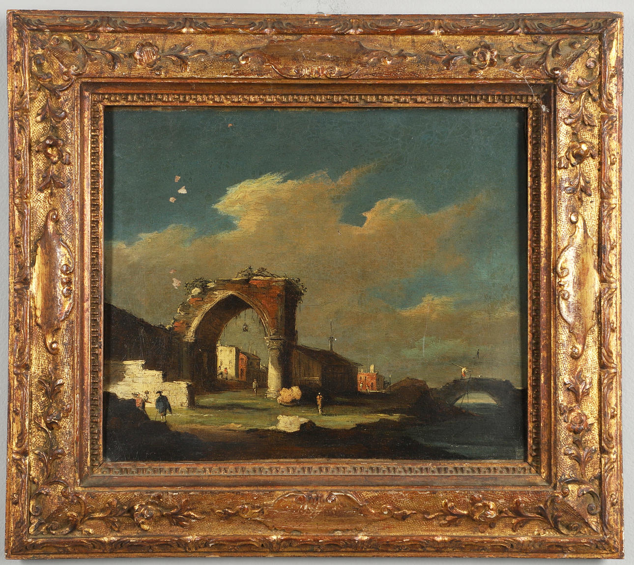AFTER FRANCESCO GUARDI (1712-1793). CAPRICCIO WITH RUINED ARCH, FISHERMAN ON BRIDGE.