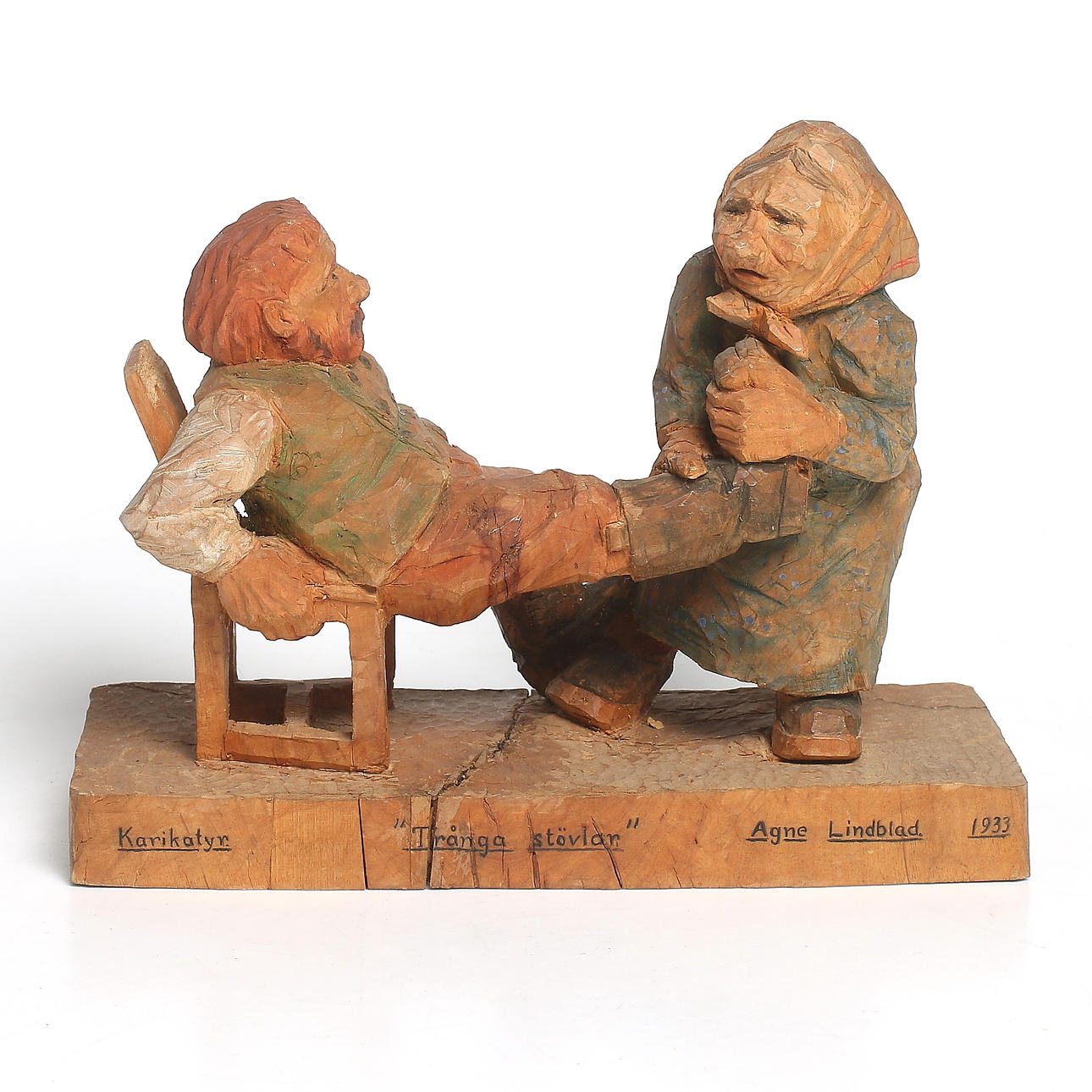 TRÄSKULPTUR, "Trånga Stövlar", Agne Lindblad, signerad och daterad 1933.