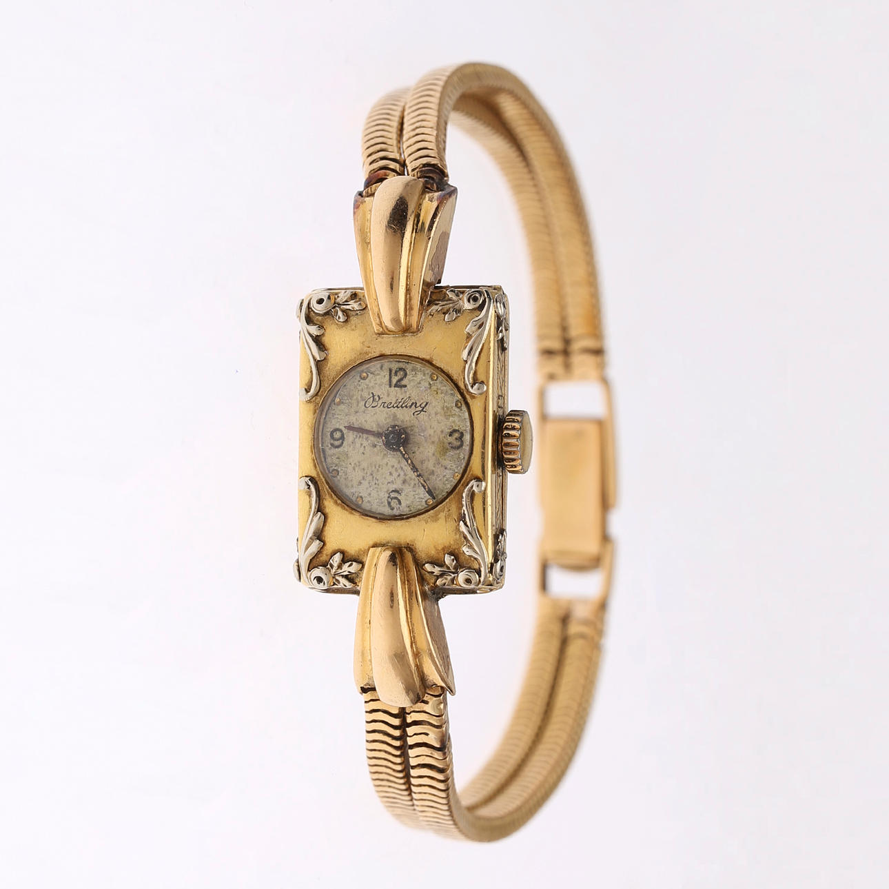 Breitling av en dam i guld, omkring 1940.