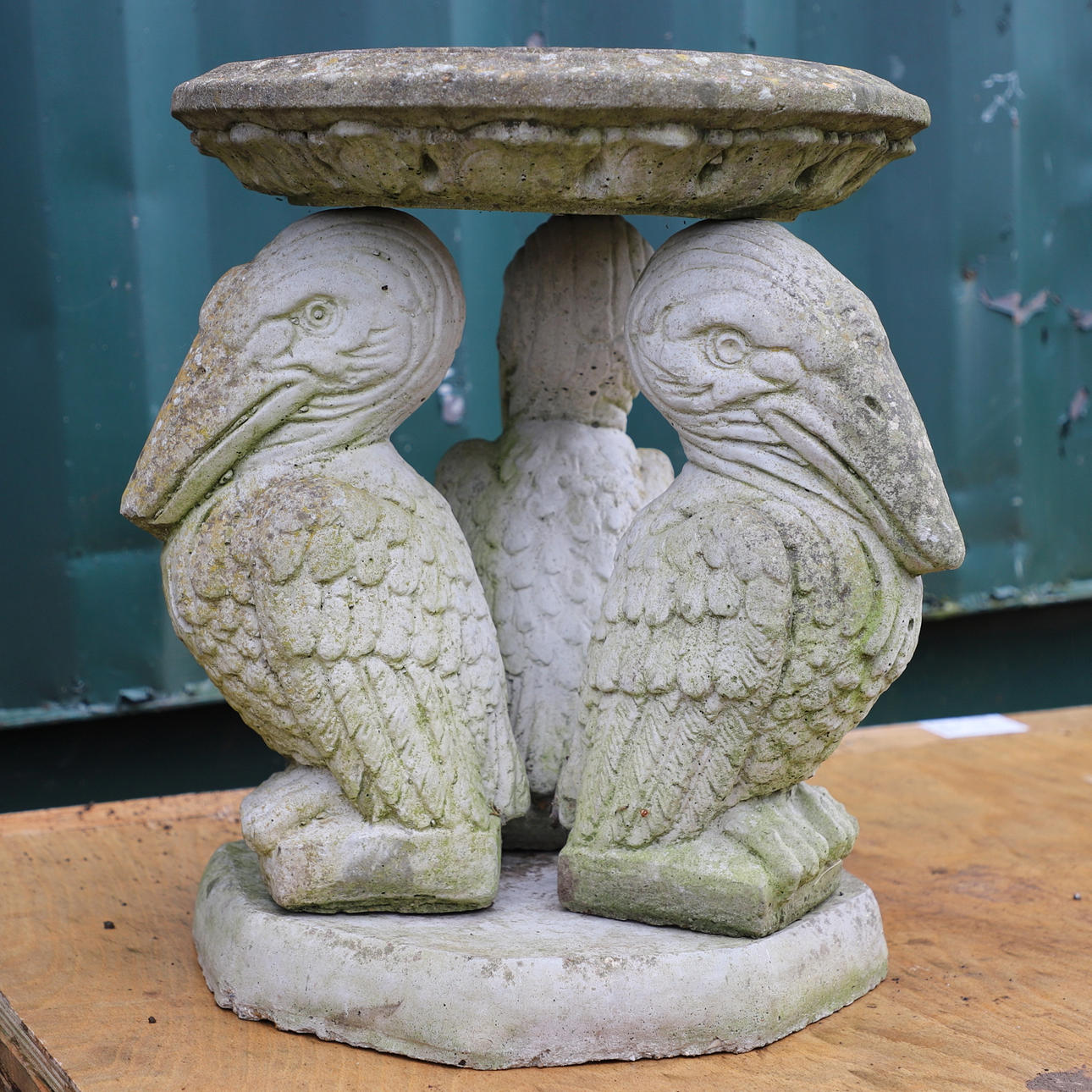 A PELICAN BIRD BATH.