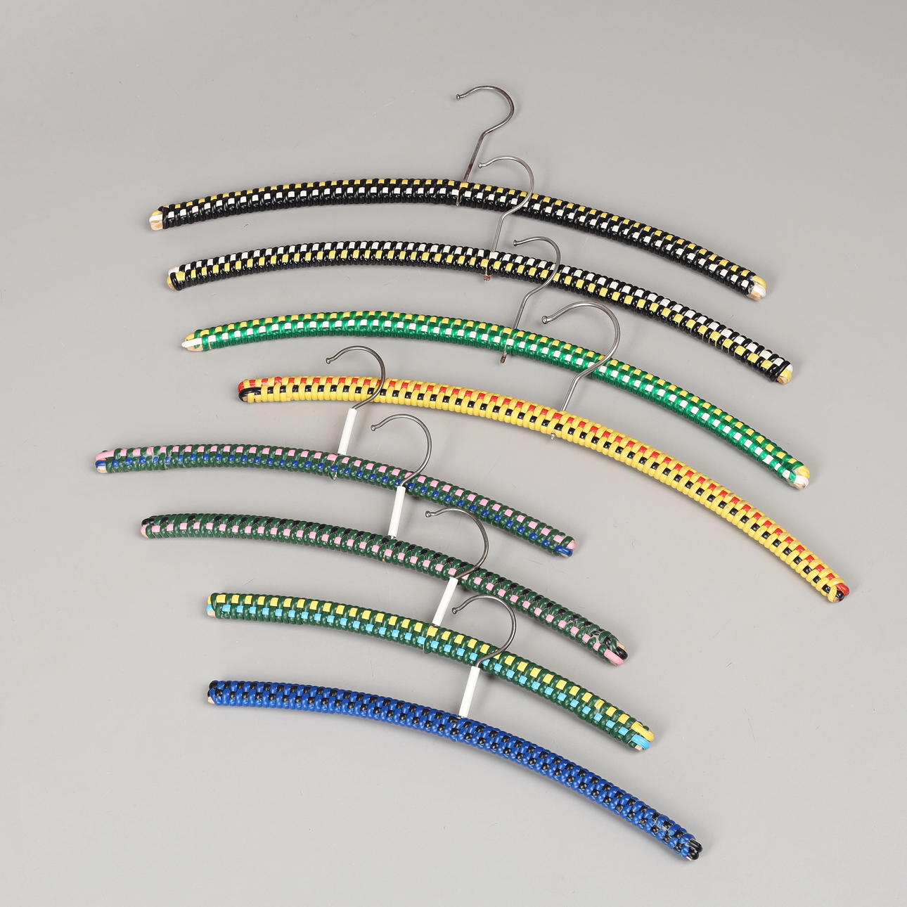 8 plastic clothes hangers, mid 20th century.