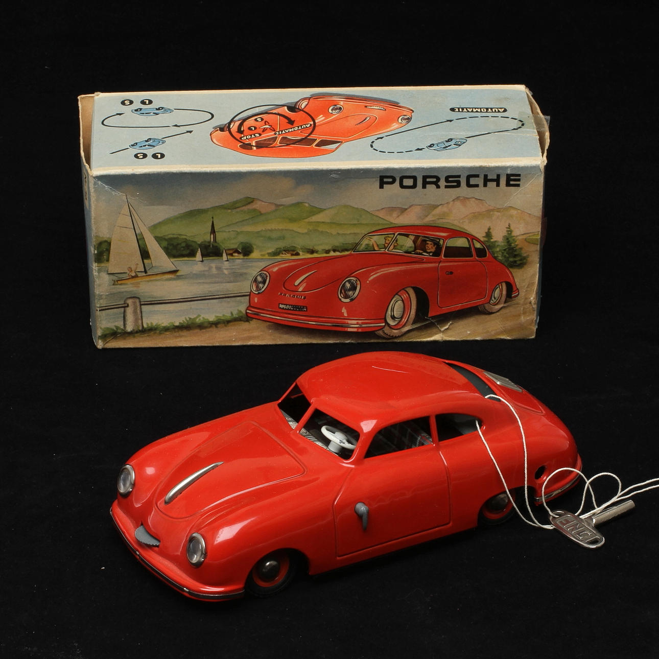 JNF PORSCHE Prototyp röd, urverk med originalnyckel, U.S.Zone, originalkartong.