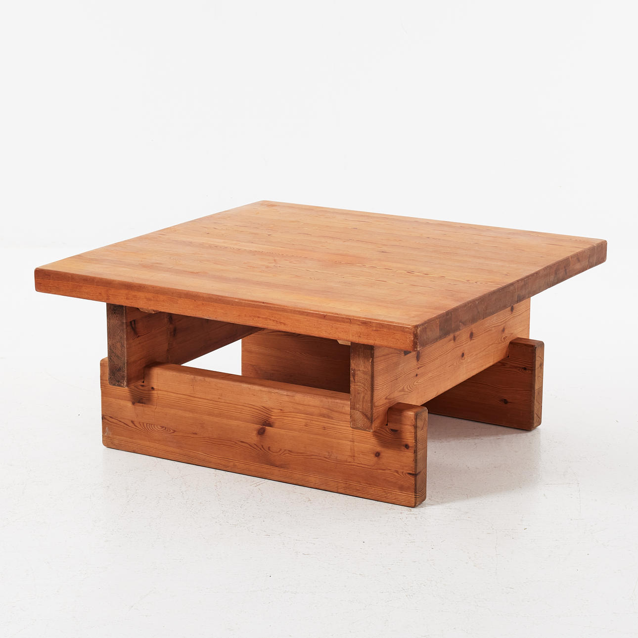 IKEA. A 1970s coffee table, solid pine, square top on connected legs.