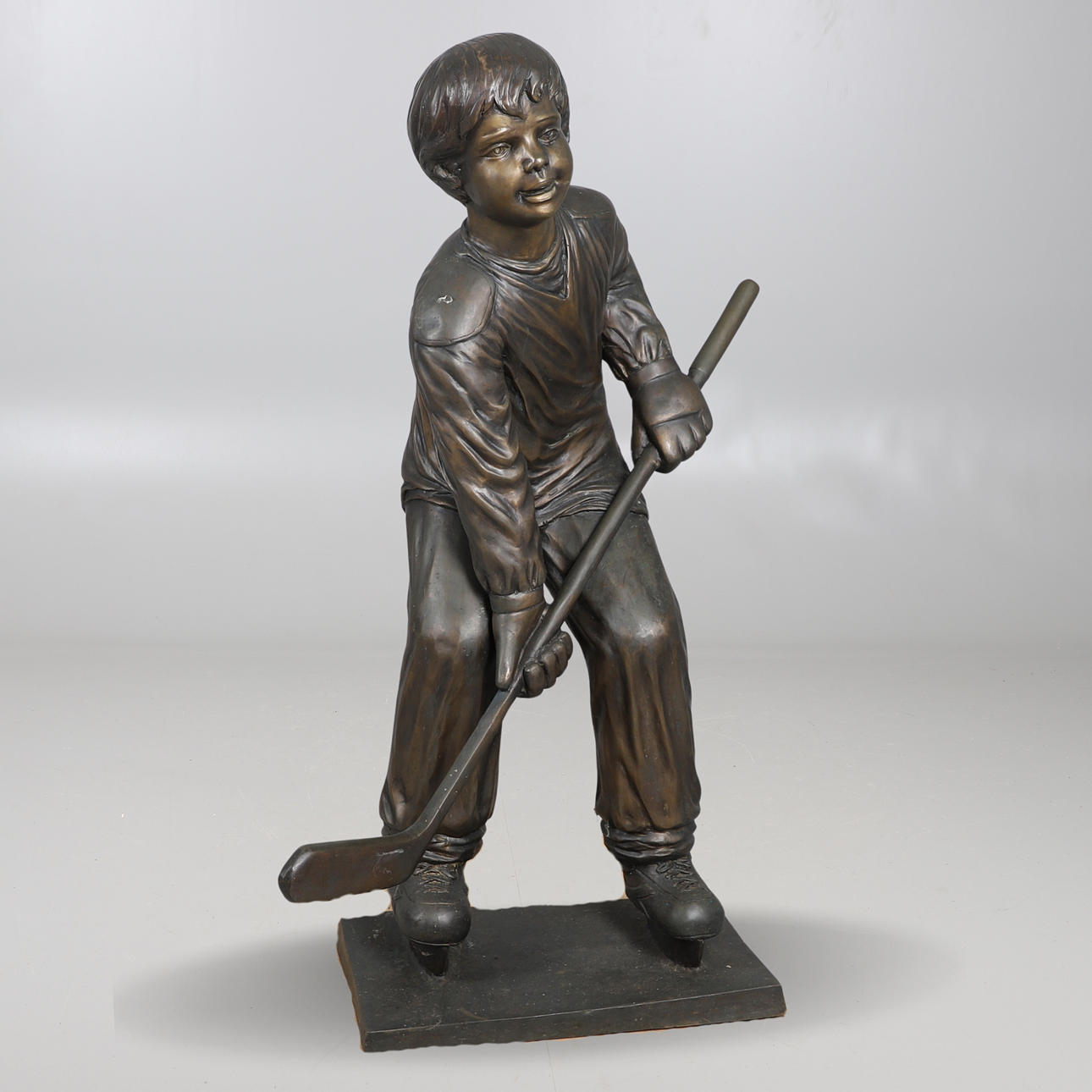 A CONTEMPORARY BRONZED METAL LIFE- SIZE STATUE.