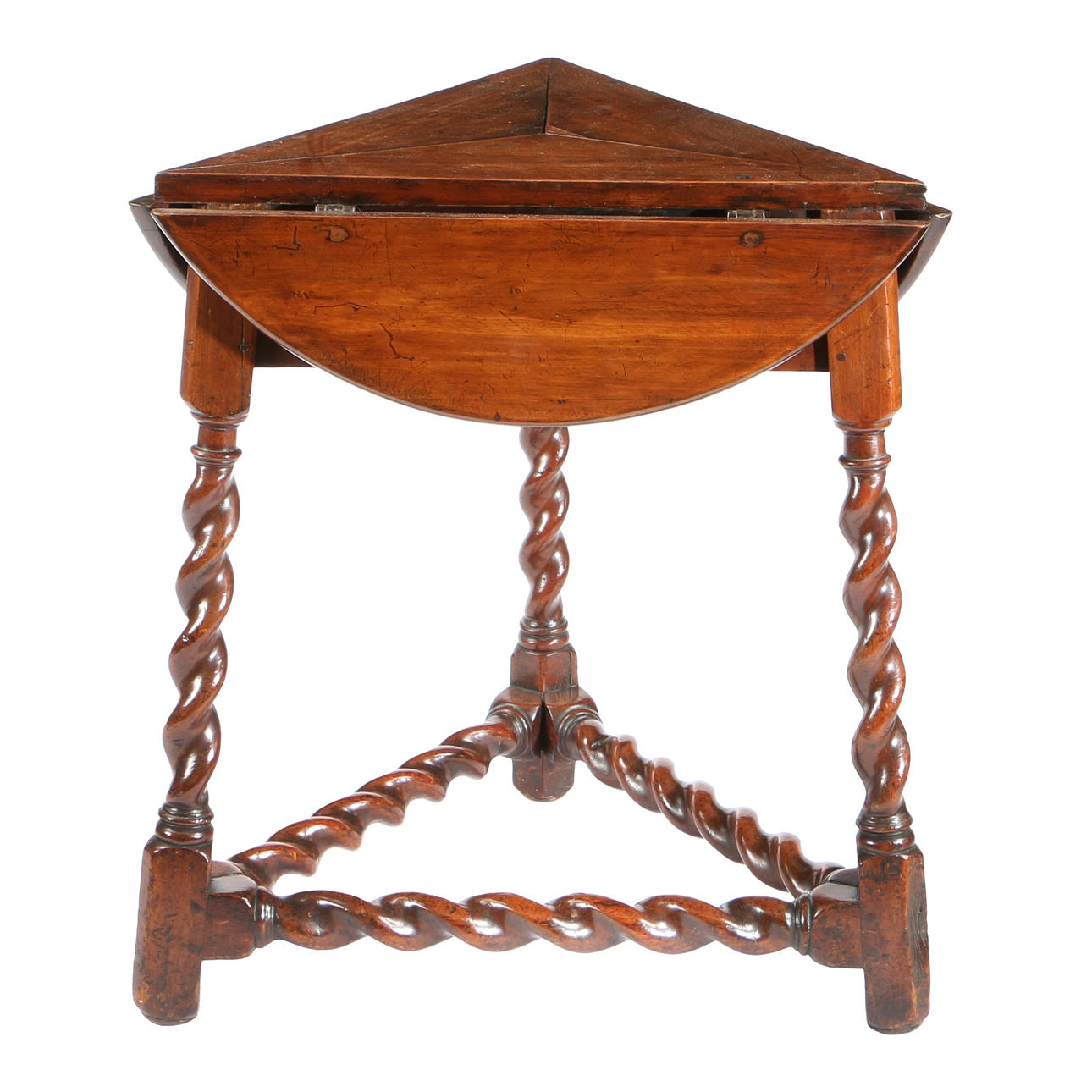 A RARE FRUITWOOD TRIANGULAR FOLDING TABLE, CIRCA 1680.
