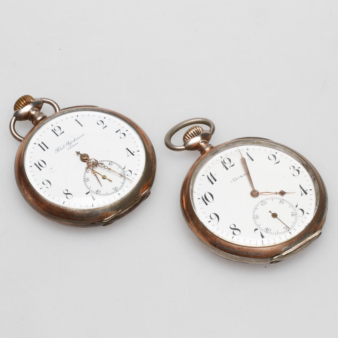 FICKUR, 2 st, silver, Doxa och Knut Björkman Upsala, 1900-talets första hälft.