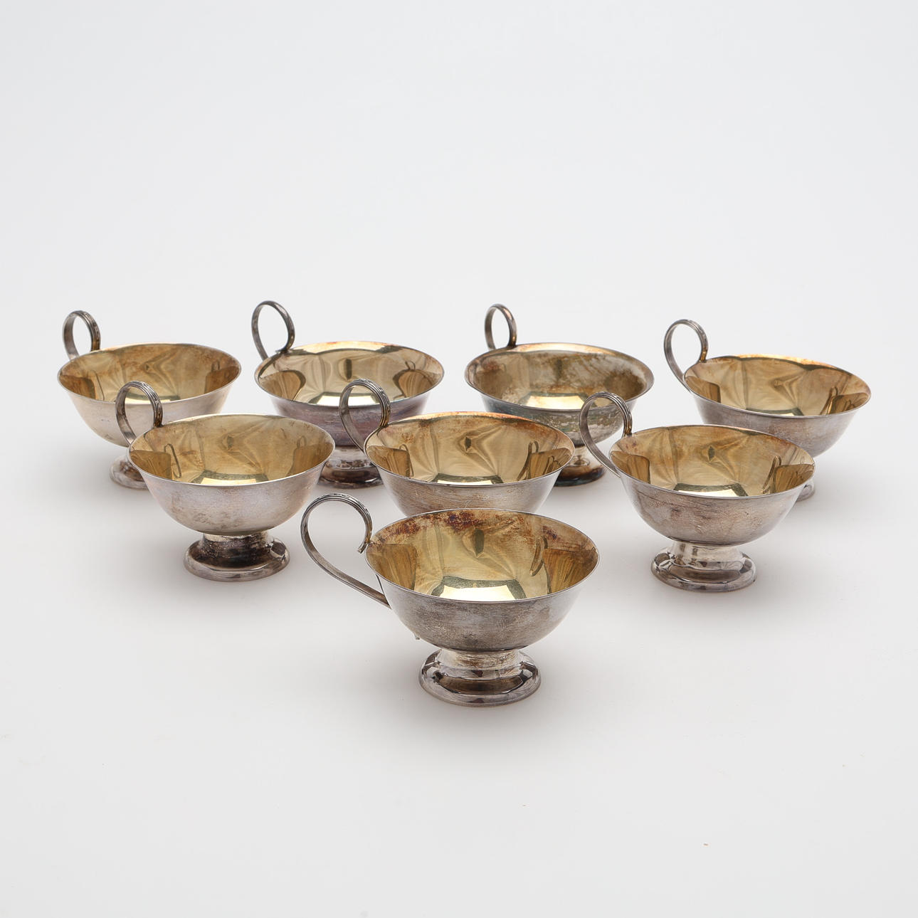 EIGHT SILVER PUNCH CUPS, SIX IN STERLING SILVER.