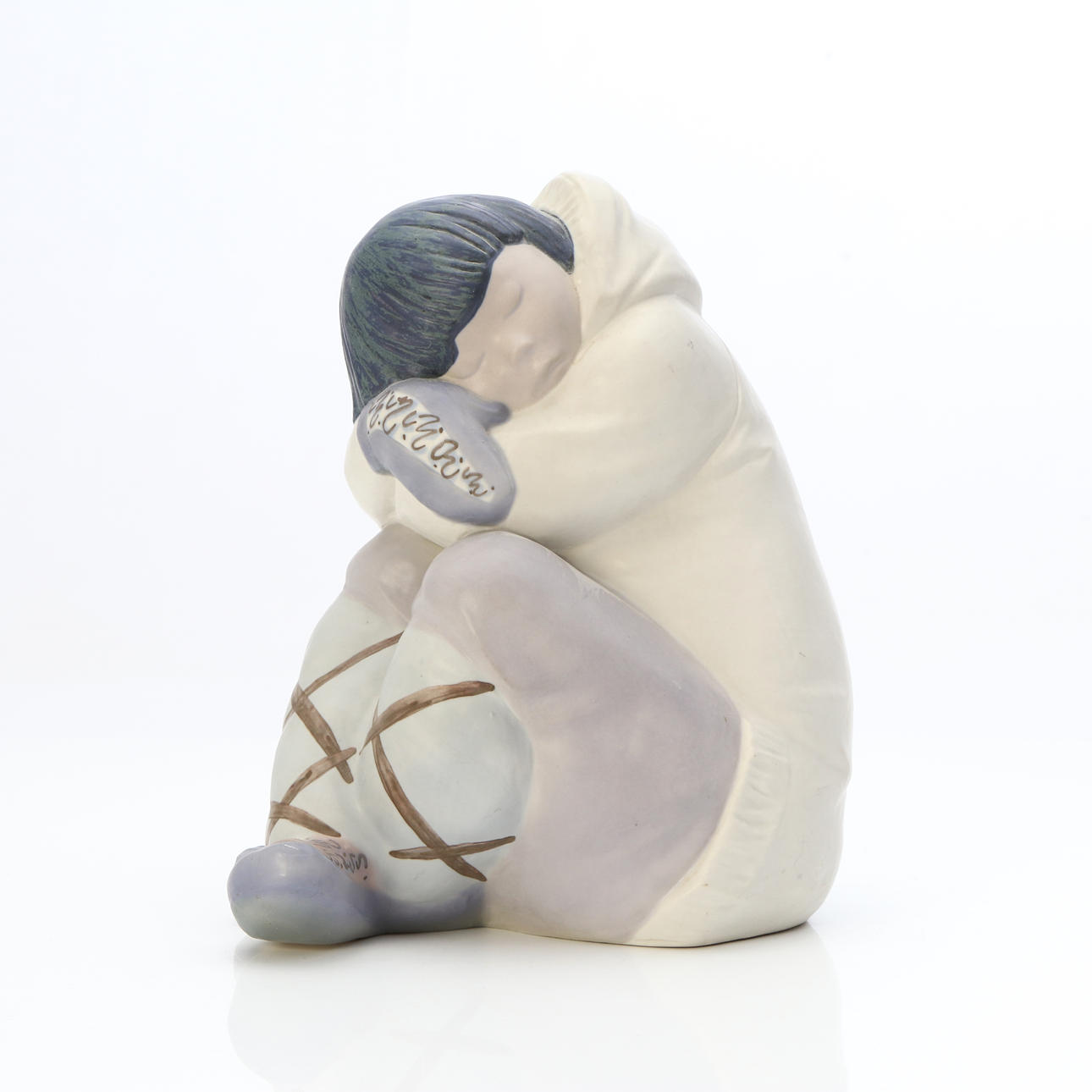 LLADRO, FIGURINE. Stoneware. Sleeping Eskimo. Marked below.