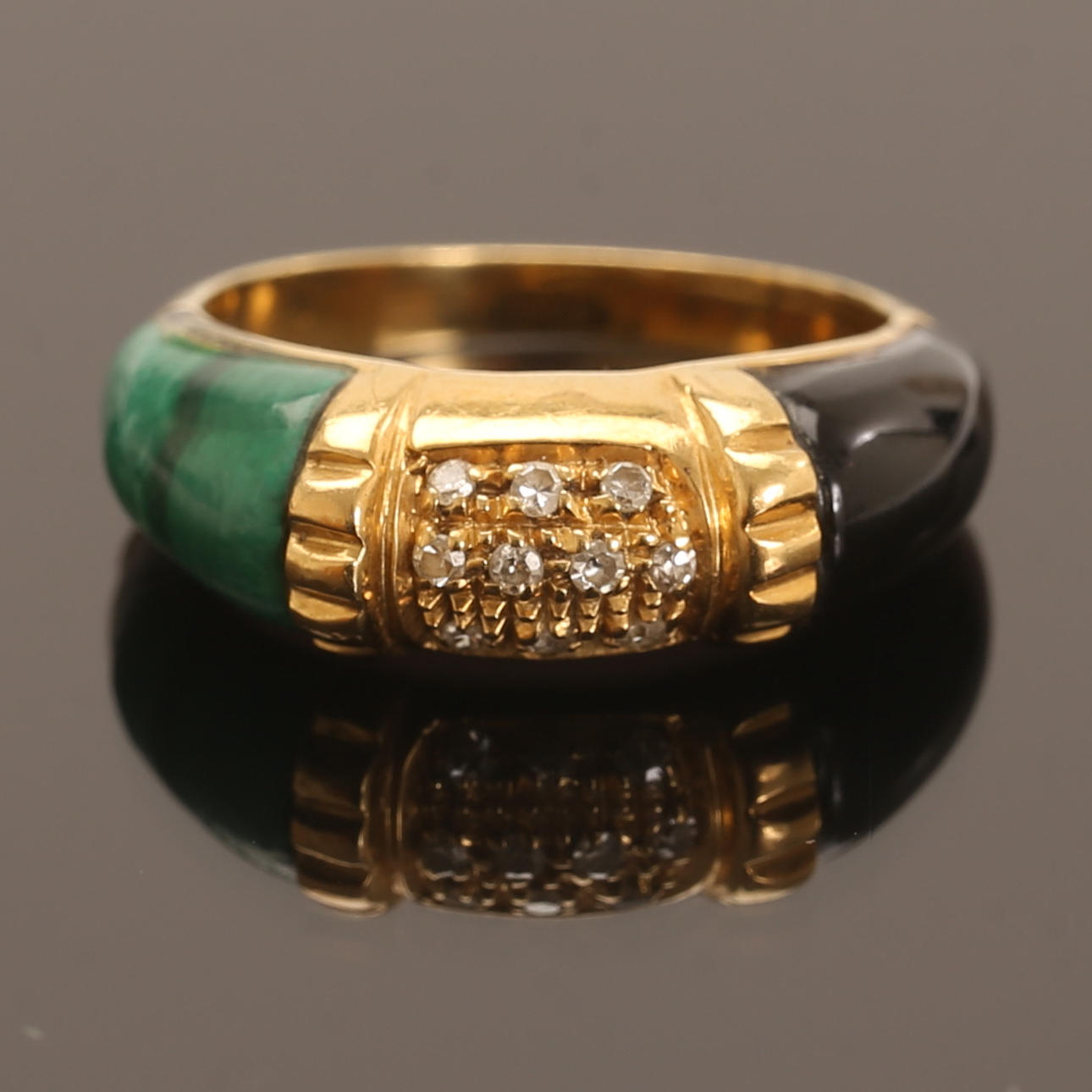 A 18k gold ring with small diamonds.