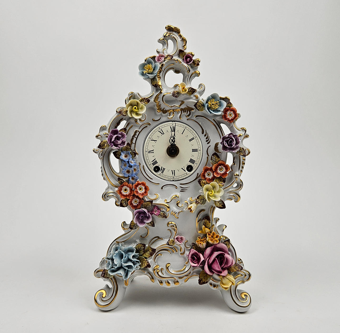 TABLE CLOCK, porcelain. Rococo style. Marked N under crown Dresden.