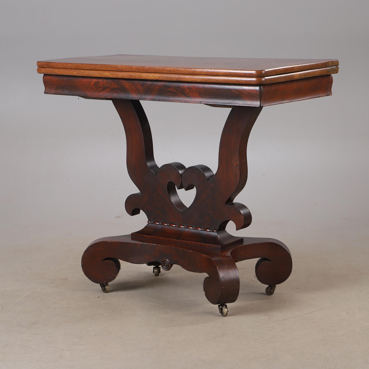 A 19th century mahogany gaming table.