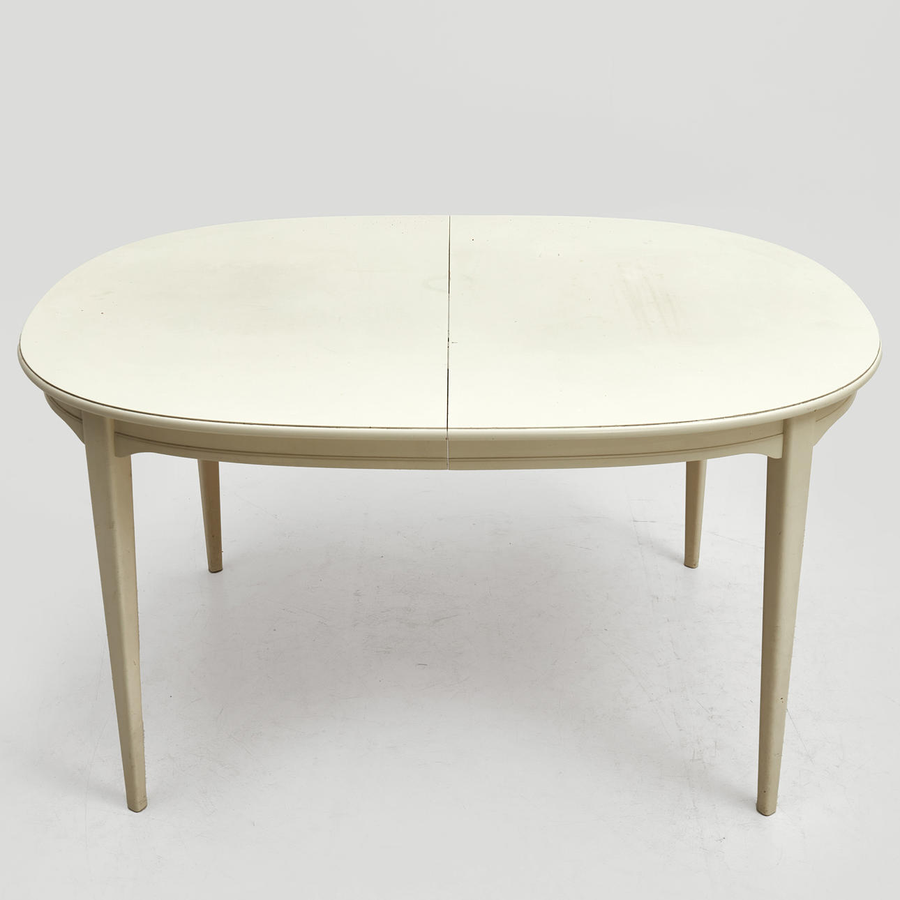SVANTE SKOGH. DINING TABLE, “Vindö”, white lacquered, with two inserts.