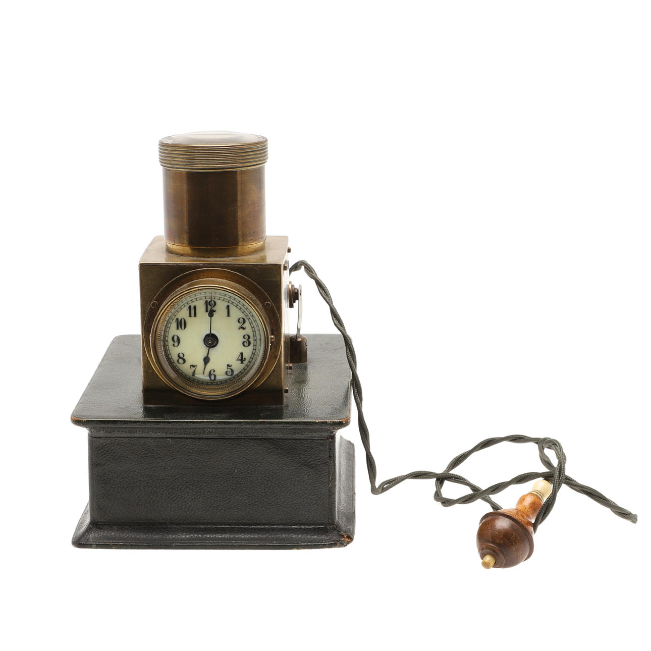AN EDWARDIAN BRASS BROTHEL CLOCK OR CEILING PROJECTOR CLOCK.