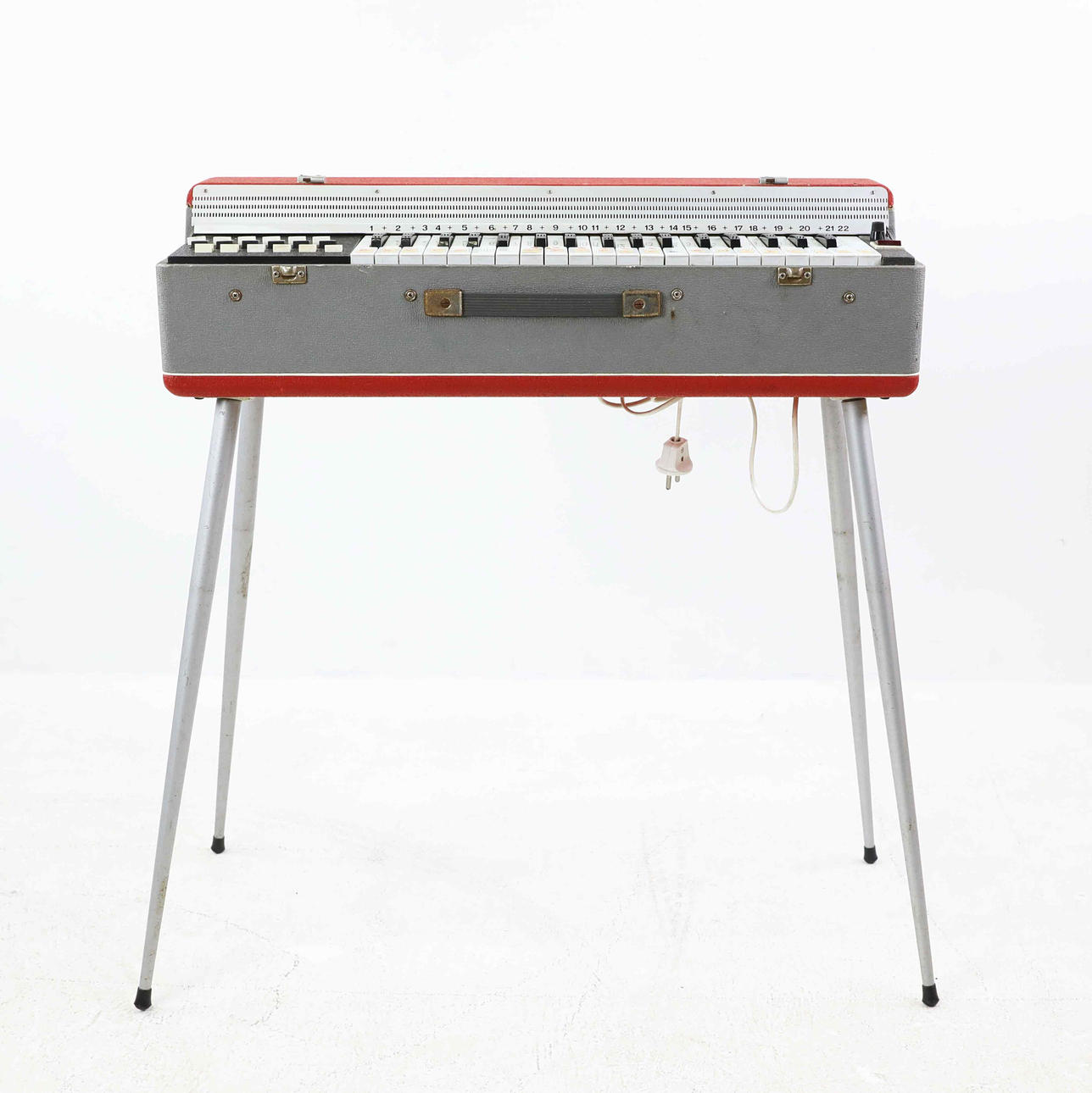 A 1960s Silvertone portable electric organ.