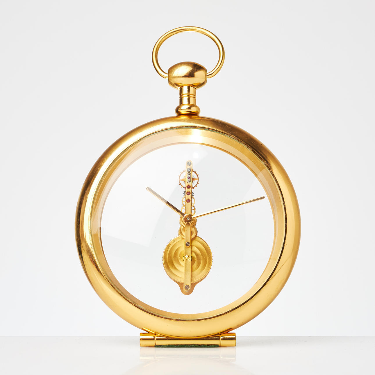TABLE CLOCK, attributed to Jaeger LeCoultre, probably previously marked, 8-day workmanship, skeleton dial, brass, ovoid shape, marked 557.