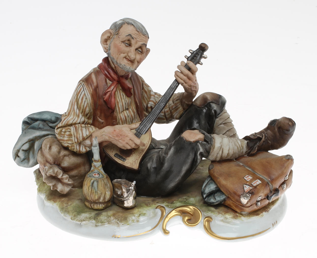 FIGURIN, keramik, Spelande man, Capo di monte, Italien.