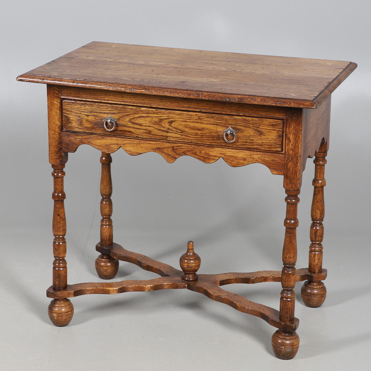 A REPRODUCTION OAK SIDE TABLE.