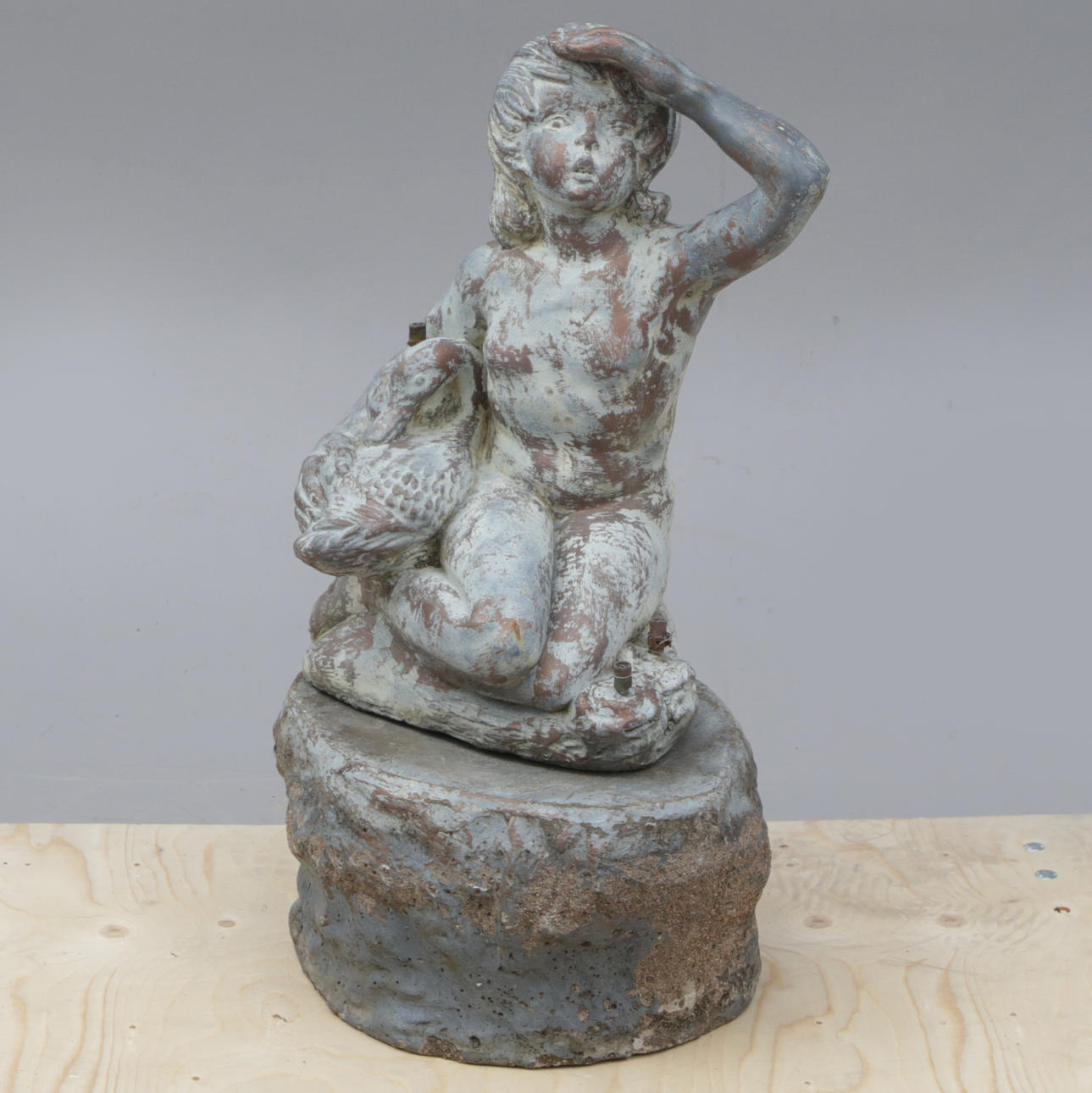 A FOUNTAIN, painted concrete, signed.