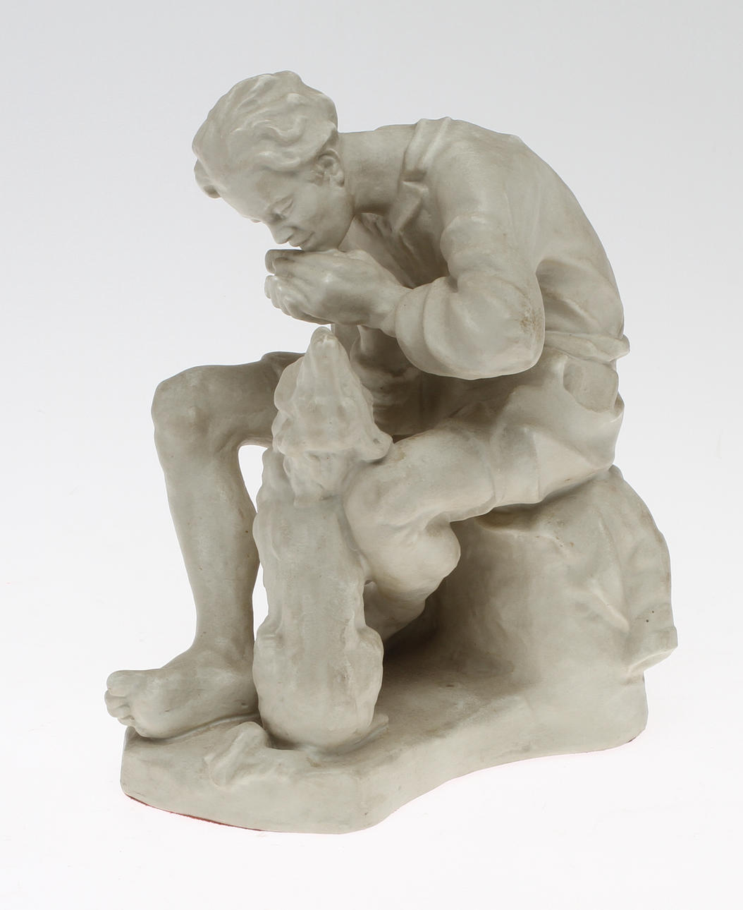 FIGURIN, föreställande Pojke med munspel och hund, parian, Rosenthal.