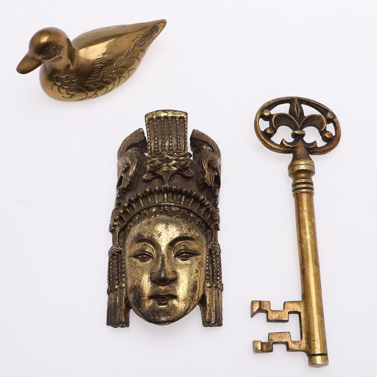A set of three brass objects, 20th century.