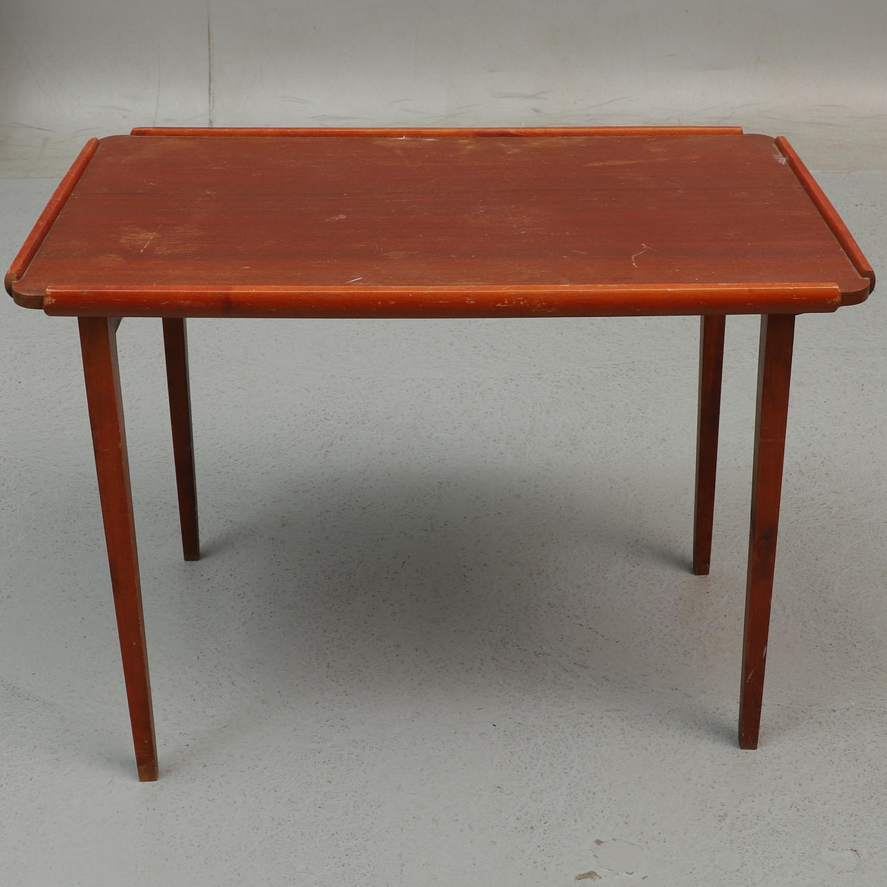 A mid 20th century mahogany folding camping table.