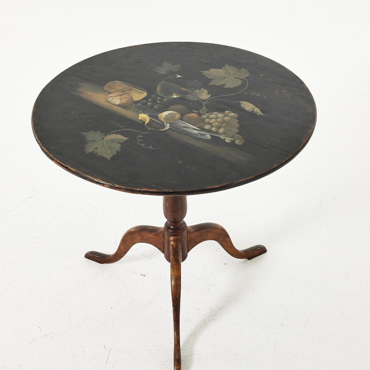 A 19th century folding table, painted decor with still lifes.