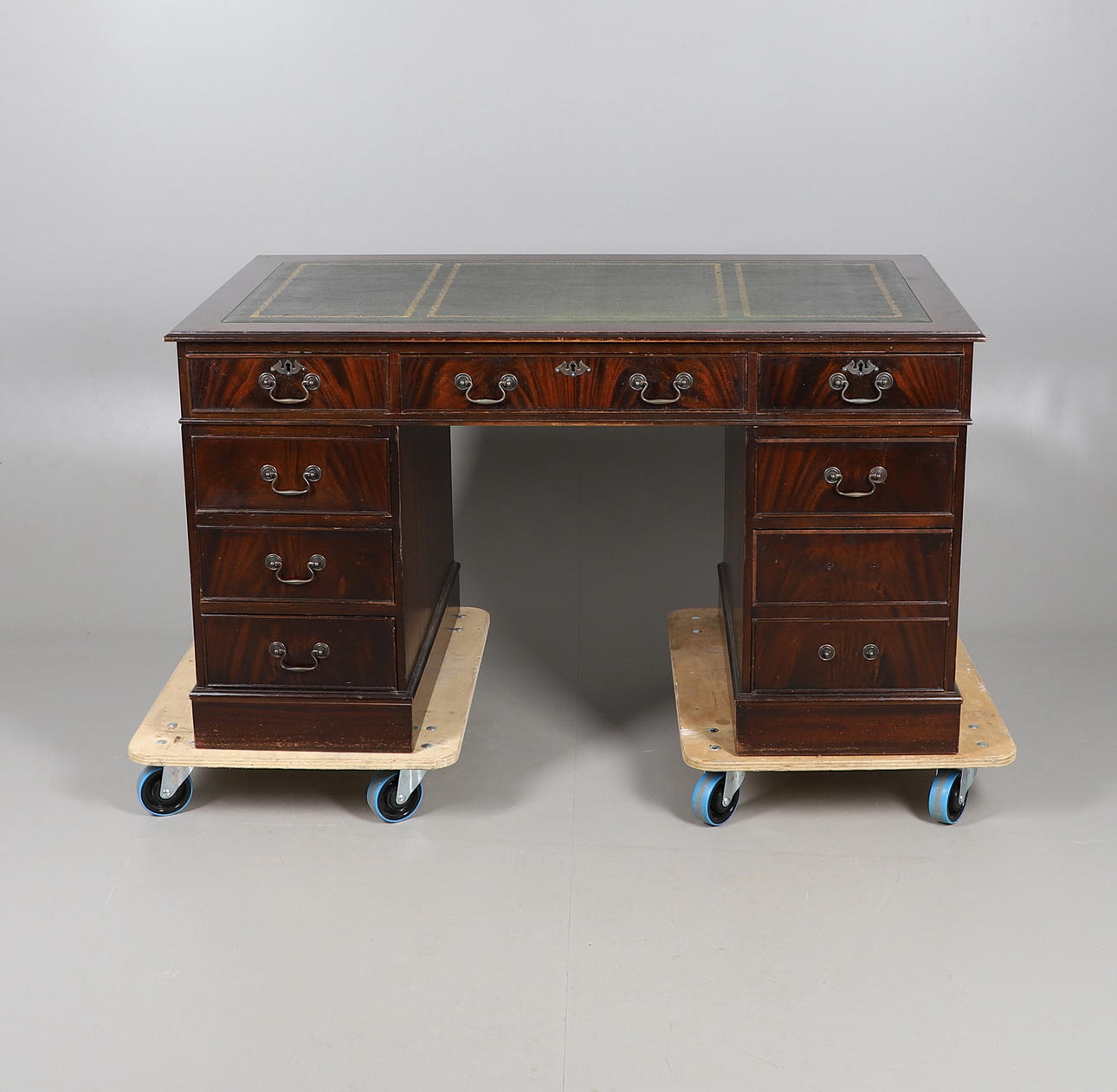 A REPRODUCTION PEDESTAL DESK.
