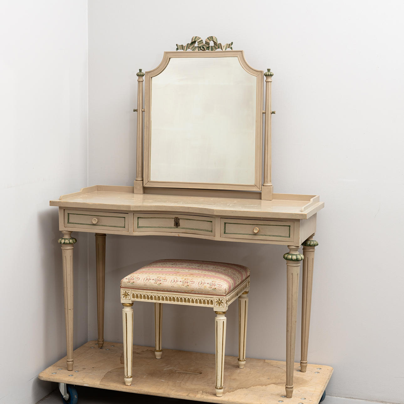A Gustavian style dressing table and stool, 20th century.