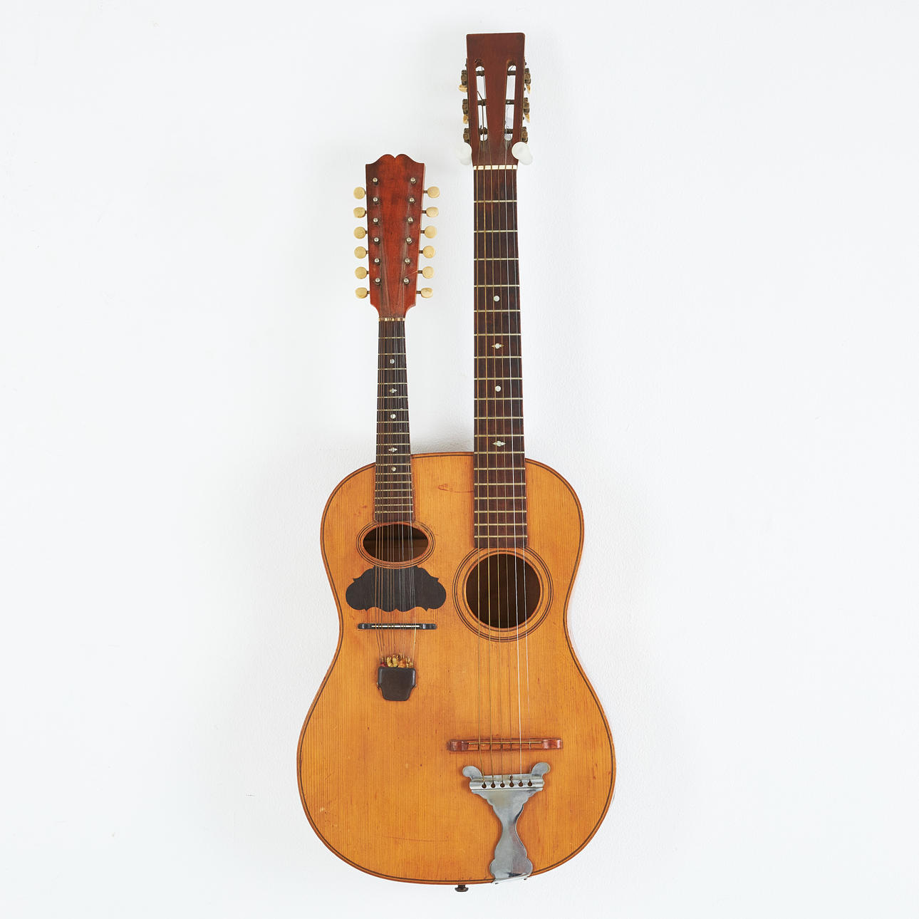 LEVIN, “Mandolinguitarr”, approx. 1914, instrument with 12-string mandolin neck and 6-string guitar neck, instrument patented by Herman Carlsson Levin, top in spruce, sarg and back in maple, made in Gothenburg soft case included.