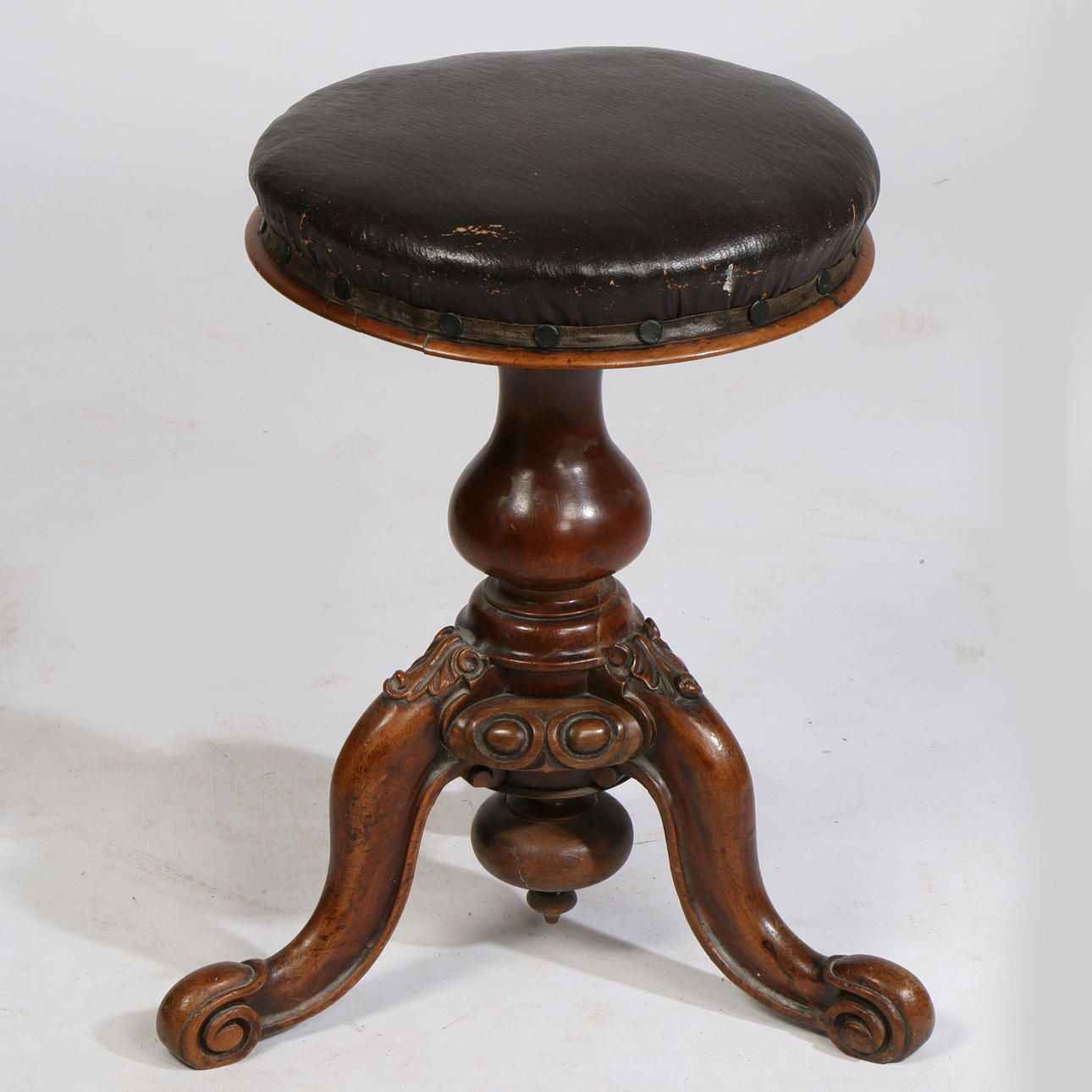 A VICTORIAN MAHOGANY PIANO STOOL.