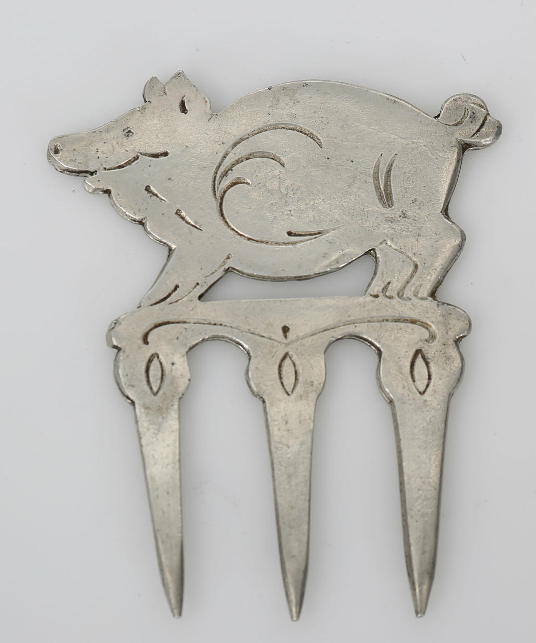 SKINKGAFFEL, tenn, 1900-tal.