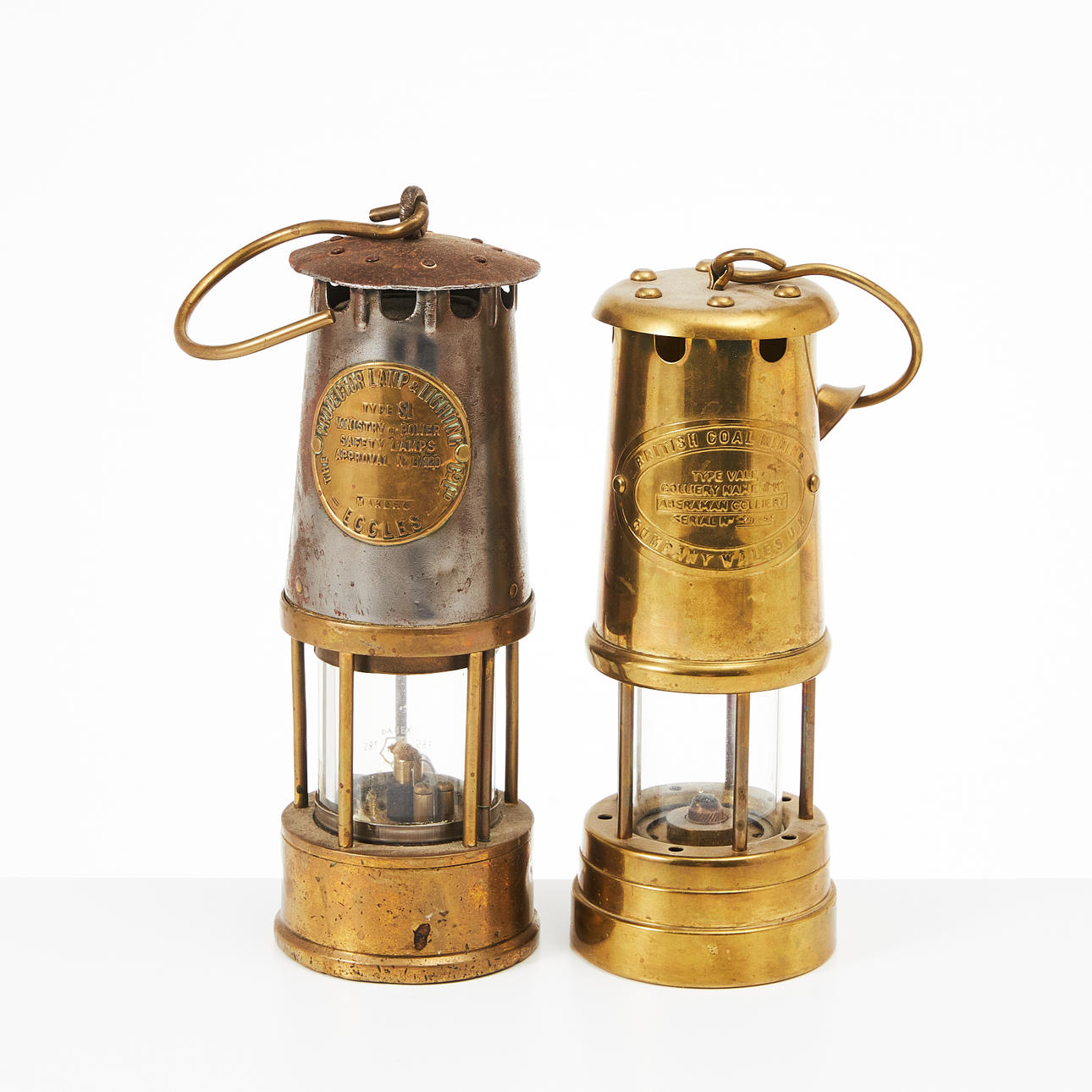 Two British mining lanterns, 20th century, brass.