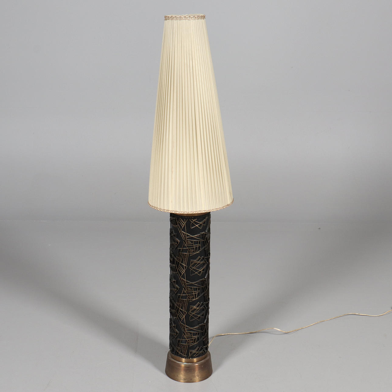 A mid 20th century wallpaper roll floor lamp.
