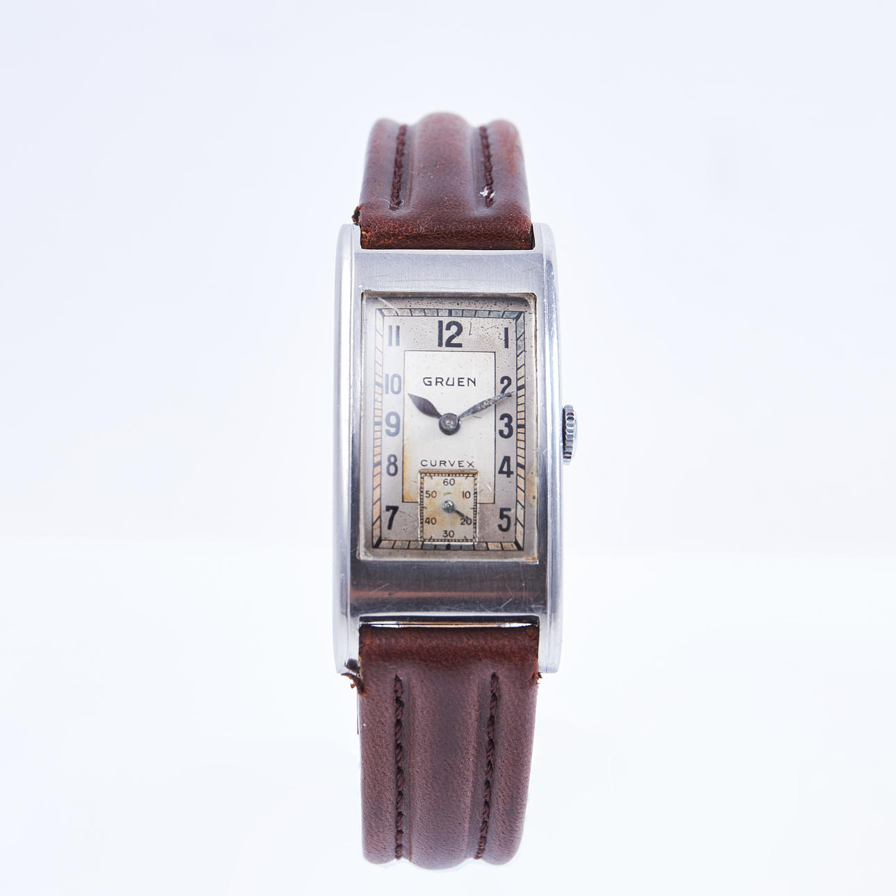 GRUEN, Wristwatch, “CurveX”, rectangular dial, small second, steel case, manual.