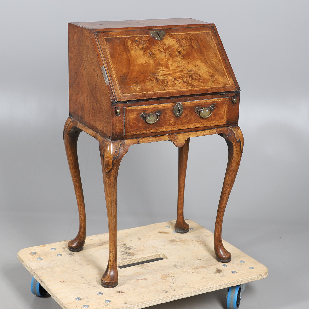 A QUEEN ANNE STYLE WALNUT BUREAU.