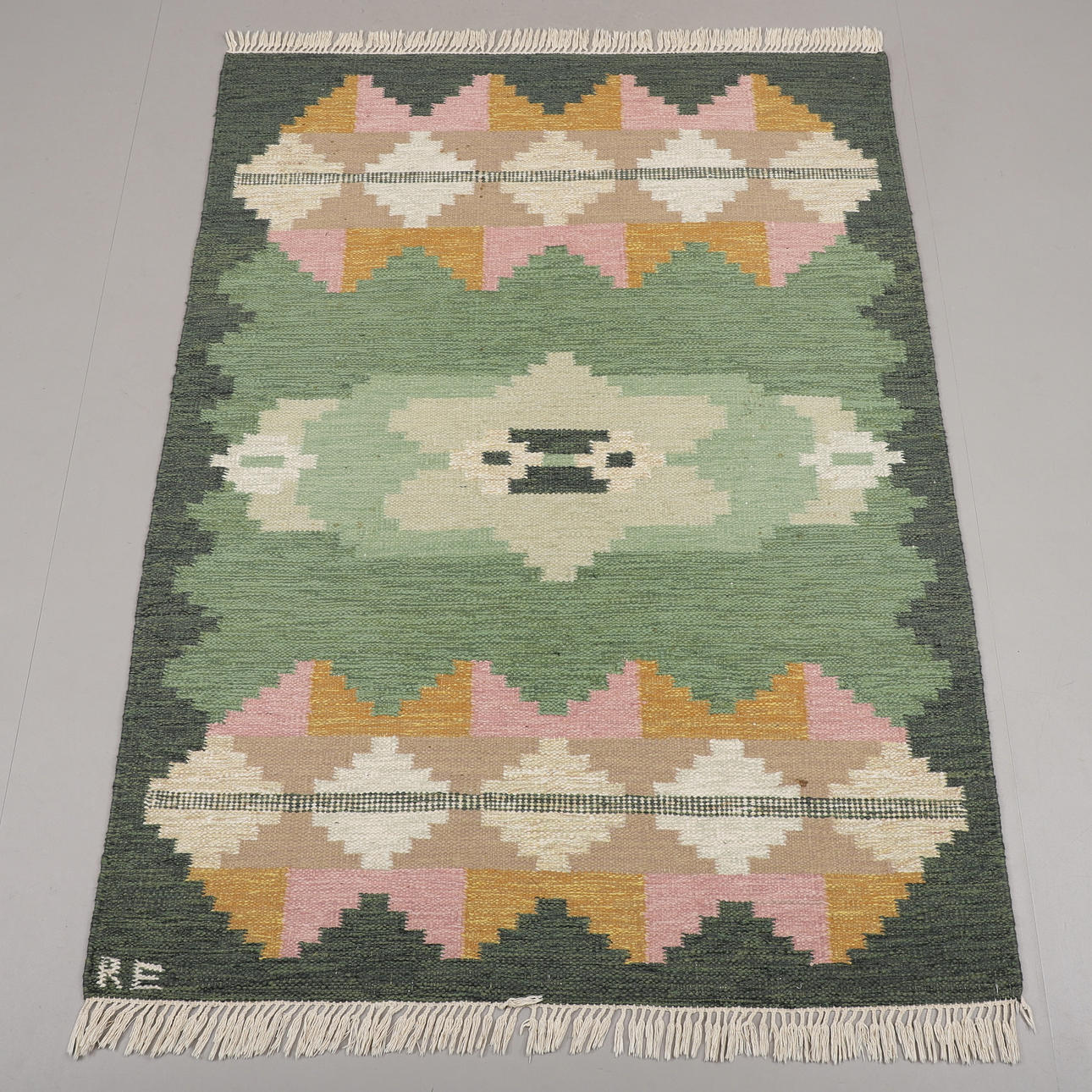A CARPET, yarrow linen, signed RE.