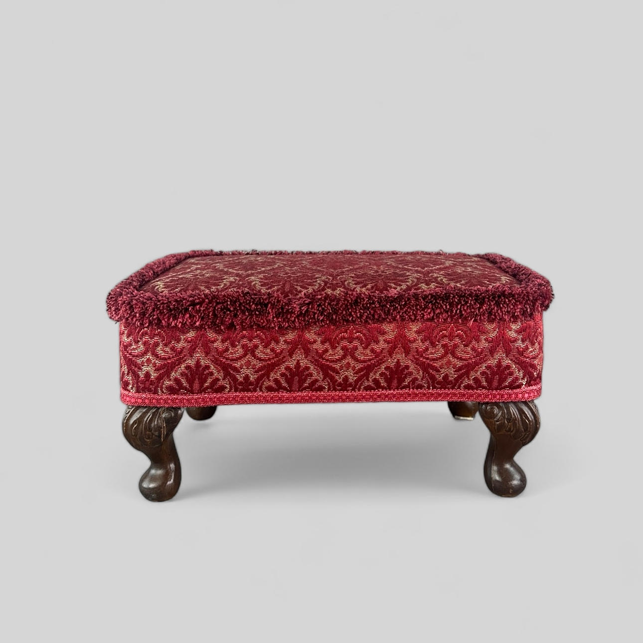 FOOTSTOOL, upholstered with red fabric, Sherborne.