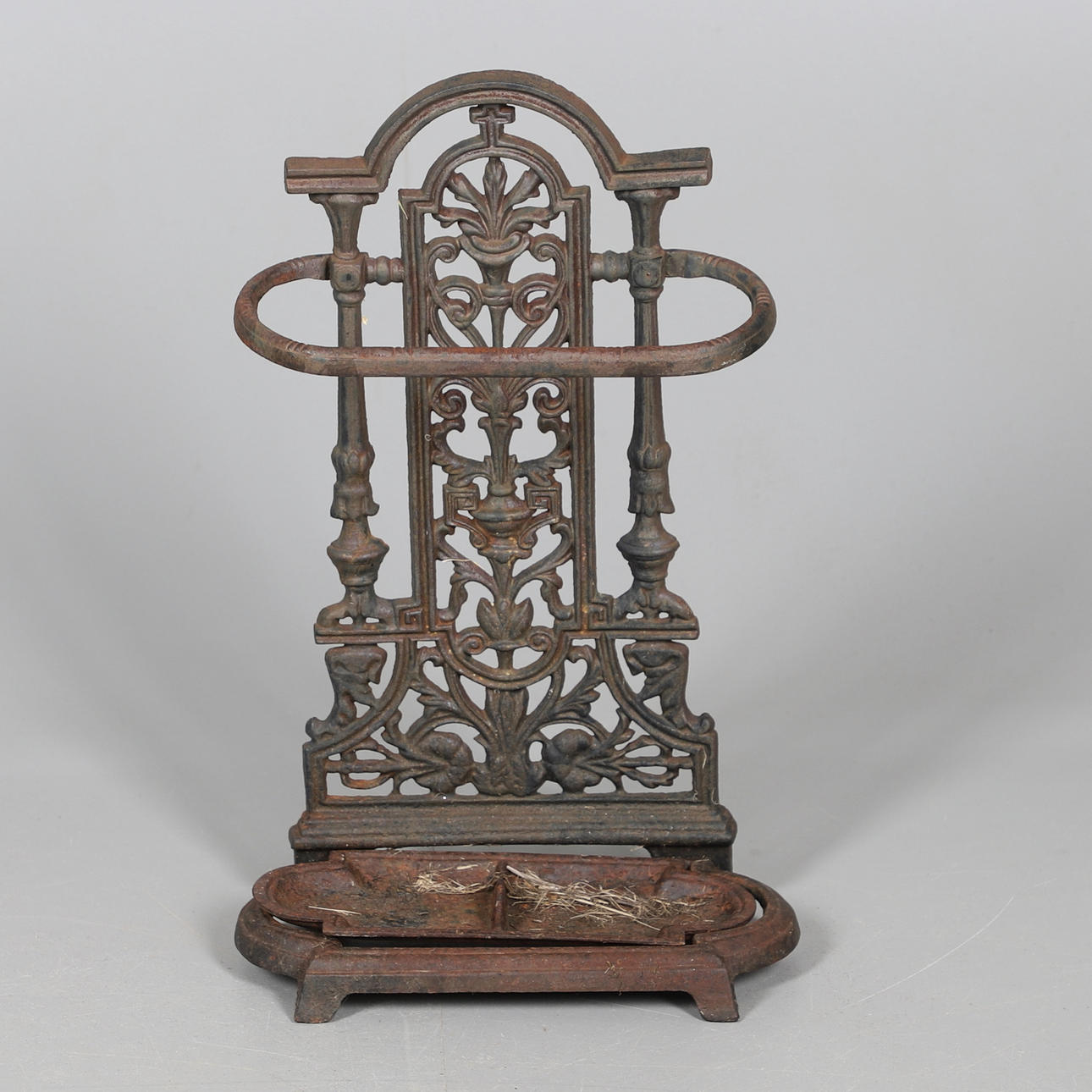 A CAST IRON STICK STAND.